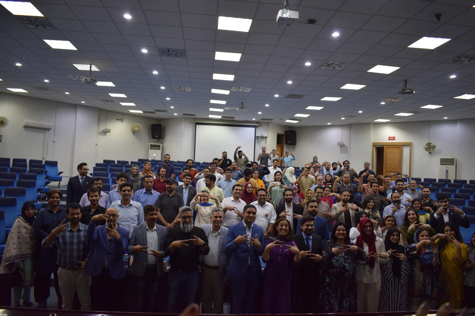 Full auditorium at a NEXT Summit gathering