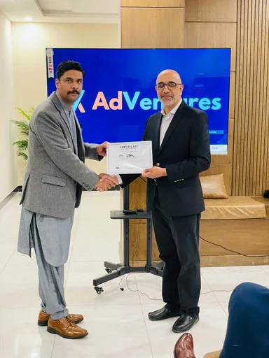 AdVentures Academy graduate receiving a certificate
