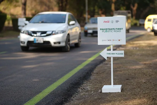 A car driving on Pakistan's first plastic road in Islamabad